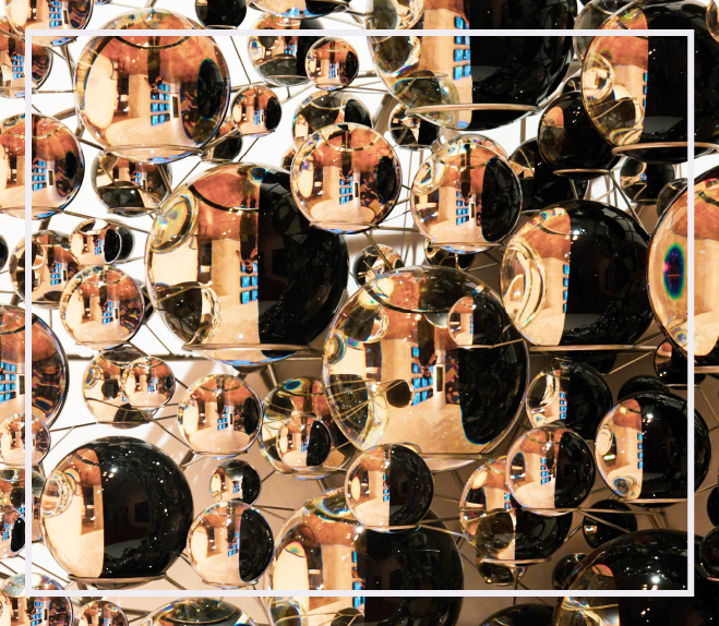 wall of cascading elliptical mirrors