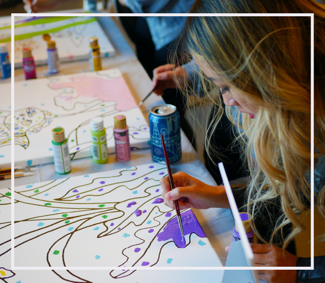 participants painting during an art in action event