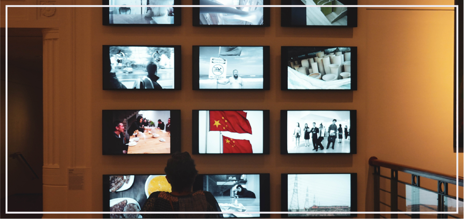 video installation exhibition with multiple screens playing propoganda videos