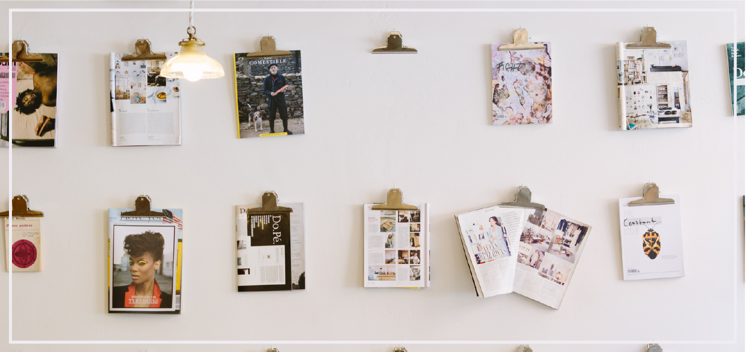 participatory exhibition with zines hanging from wall