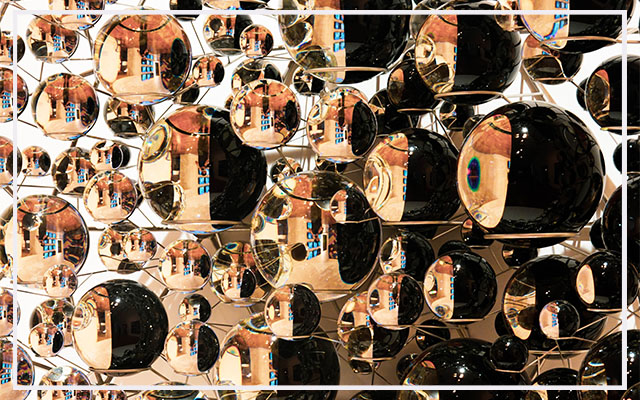 wall of cascading elliptical mirrors