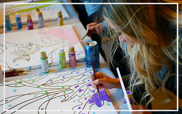 participants painting during an art in action event