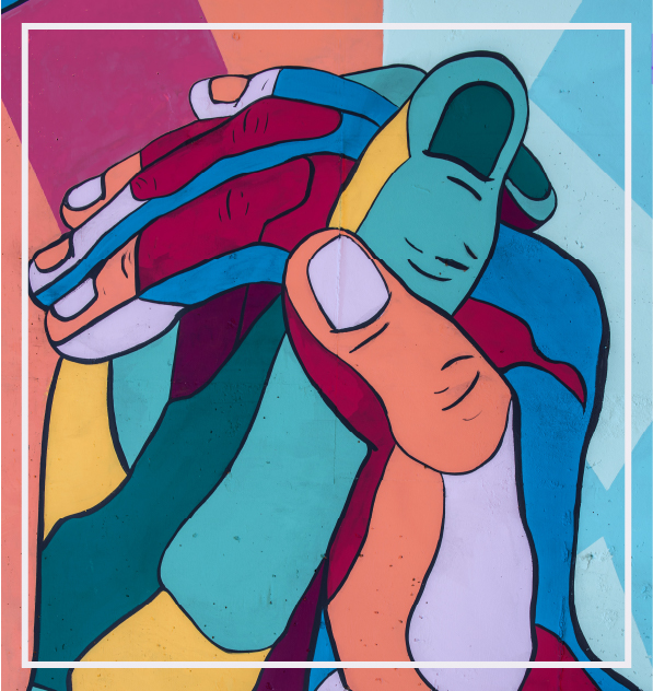colorful mural of two hands held in solidarity